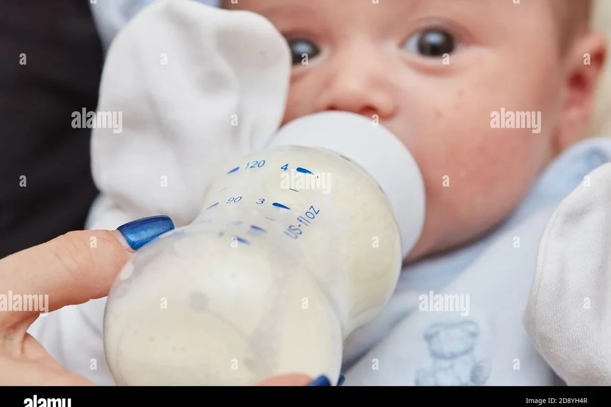 Newborn baby lying safely in a crib with soft natural light