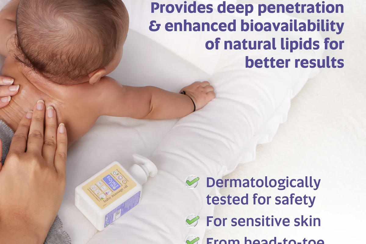 Parent gently massaging a baby on a soft blanket in a calm nursery setting